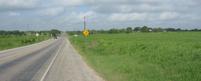 Wheelchair sign along side of farm road